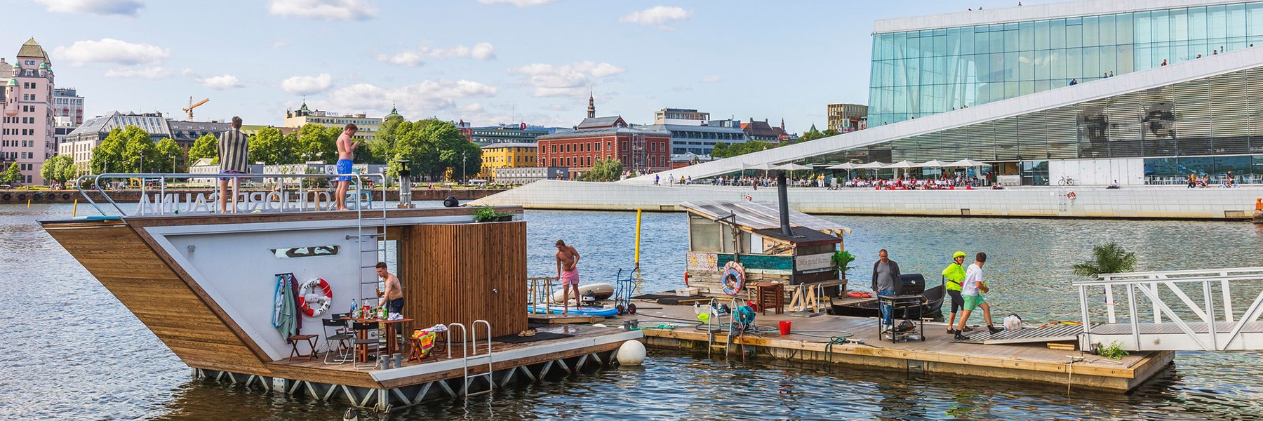 people enjoying floating sauna in norway river